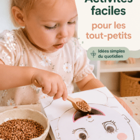 Un enfant s'amusant avec des jouets faits maison en carton coloré.