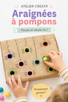 Un pompon araignée coloré fait à la main, accompagné de fils et de ciseaux.