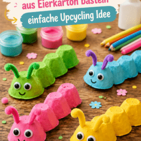 Une chenille en carton découpée et peinte par un enfant dans un cadre coloré.